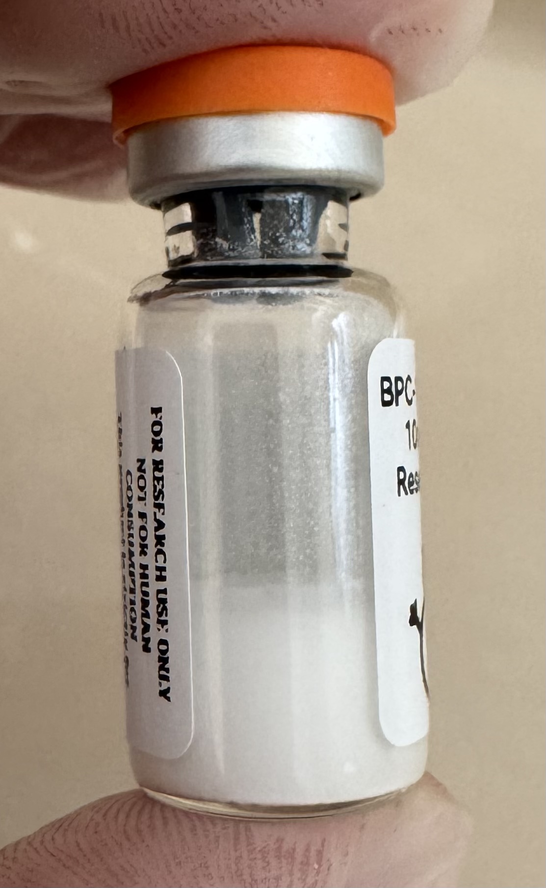 Lyophilized BPC-157 + TB-500 combined 10mg/10mg powder cake inside the sealed vial