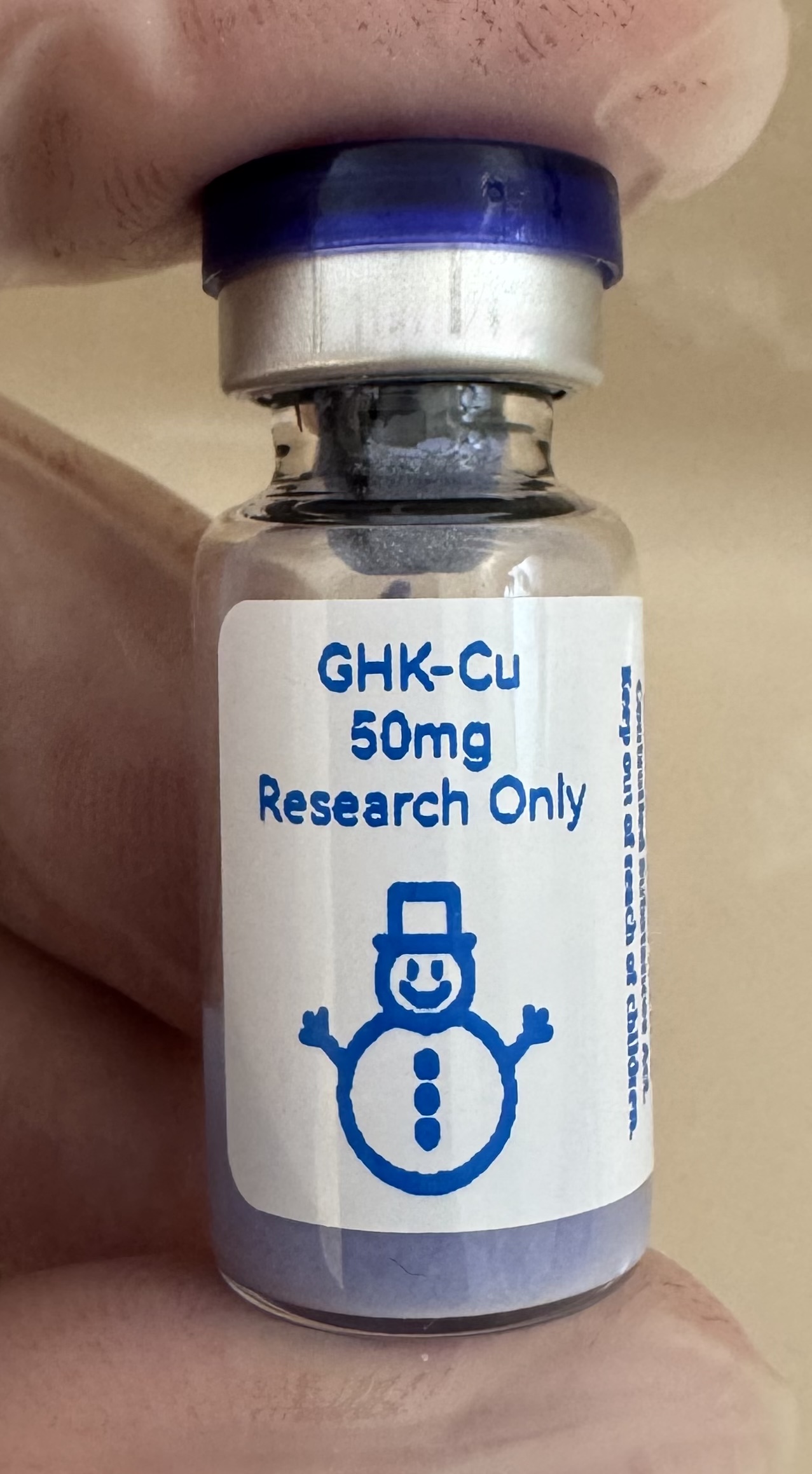 GHK-Cu copper tripeptide 50mg freeze-dried research vial with the snowman label