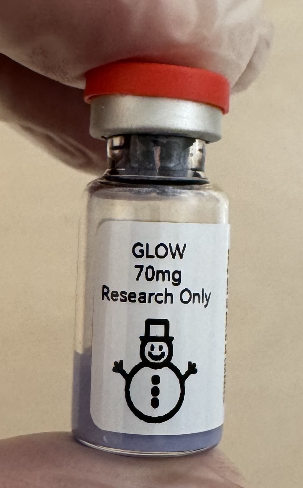 GLOW (GHK-Cu + BPC-157 + TB-500) 70mg freeze-dried research vial with the snowman label