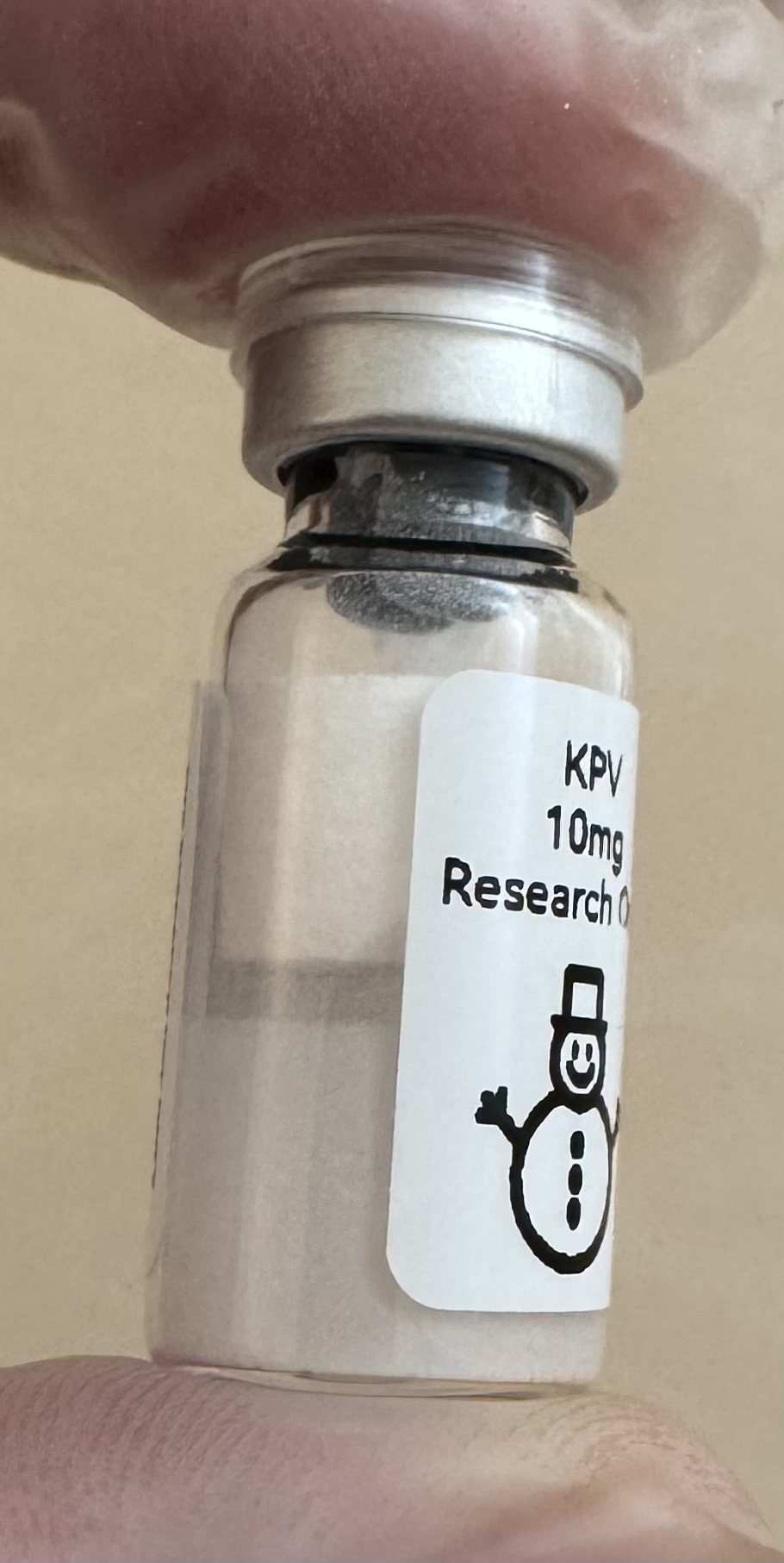 Side view of the KPV tripeptide (Lys-Pro-Val) 10mg vial showing the lyophilized powder