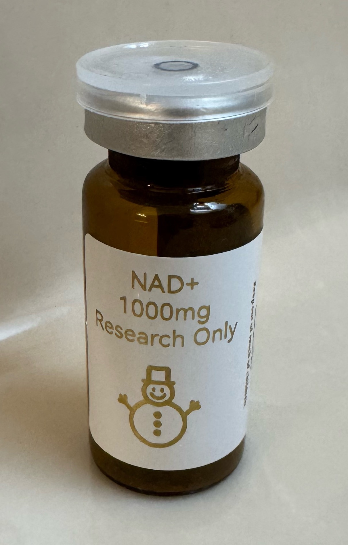 NAD+ (nicotinamide adenine dinucleotide) 1000mg freeze-dried research vial with the snowman label