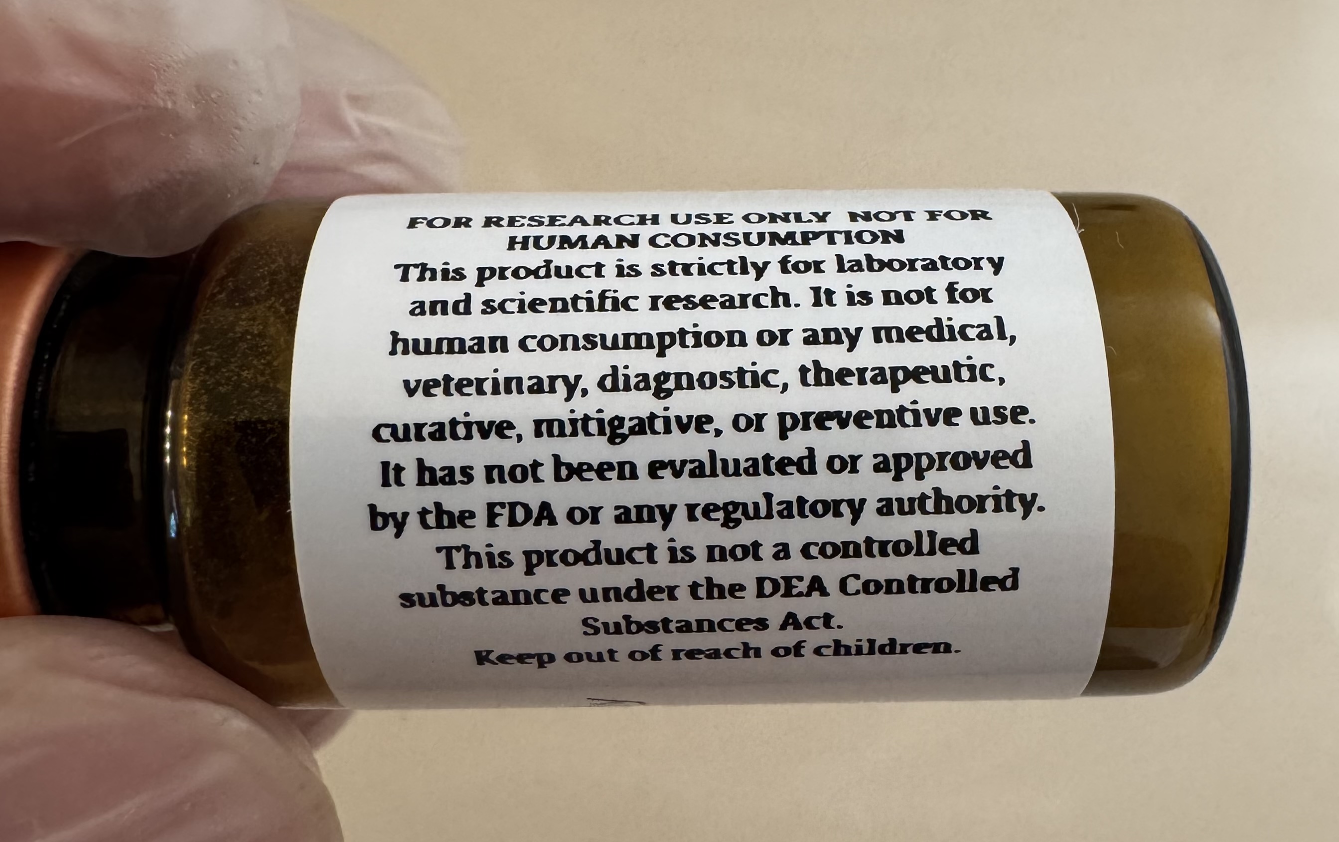 Lyophilized NAD+ (nicotinamide adenine dinucleotide) 500mg powder cake inside the sealed vial
