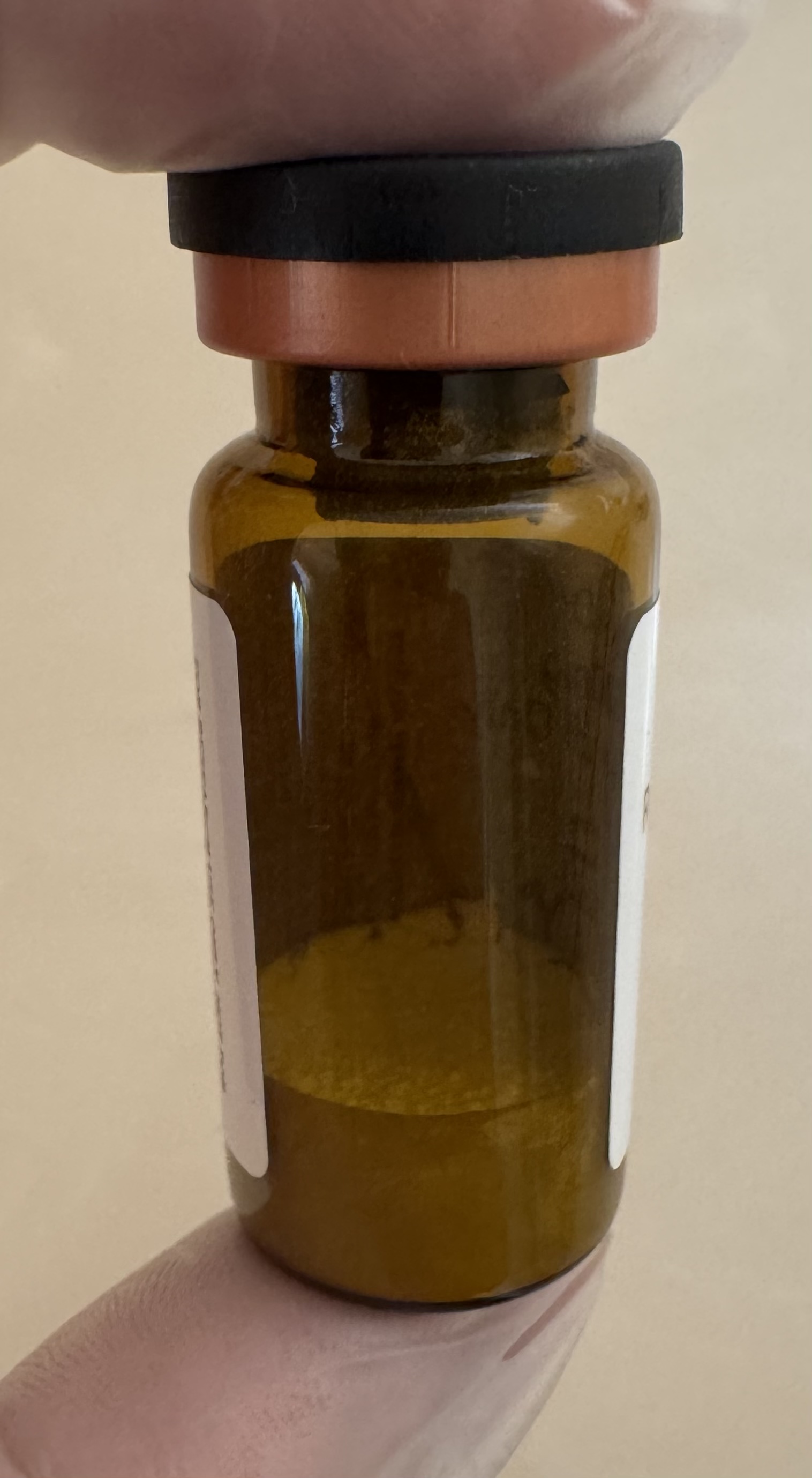 Side view of the NAD+ (nicotinamide adenine dinucleotide) 500mg vial showing the lyophilized powder