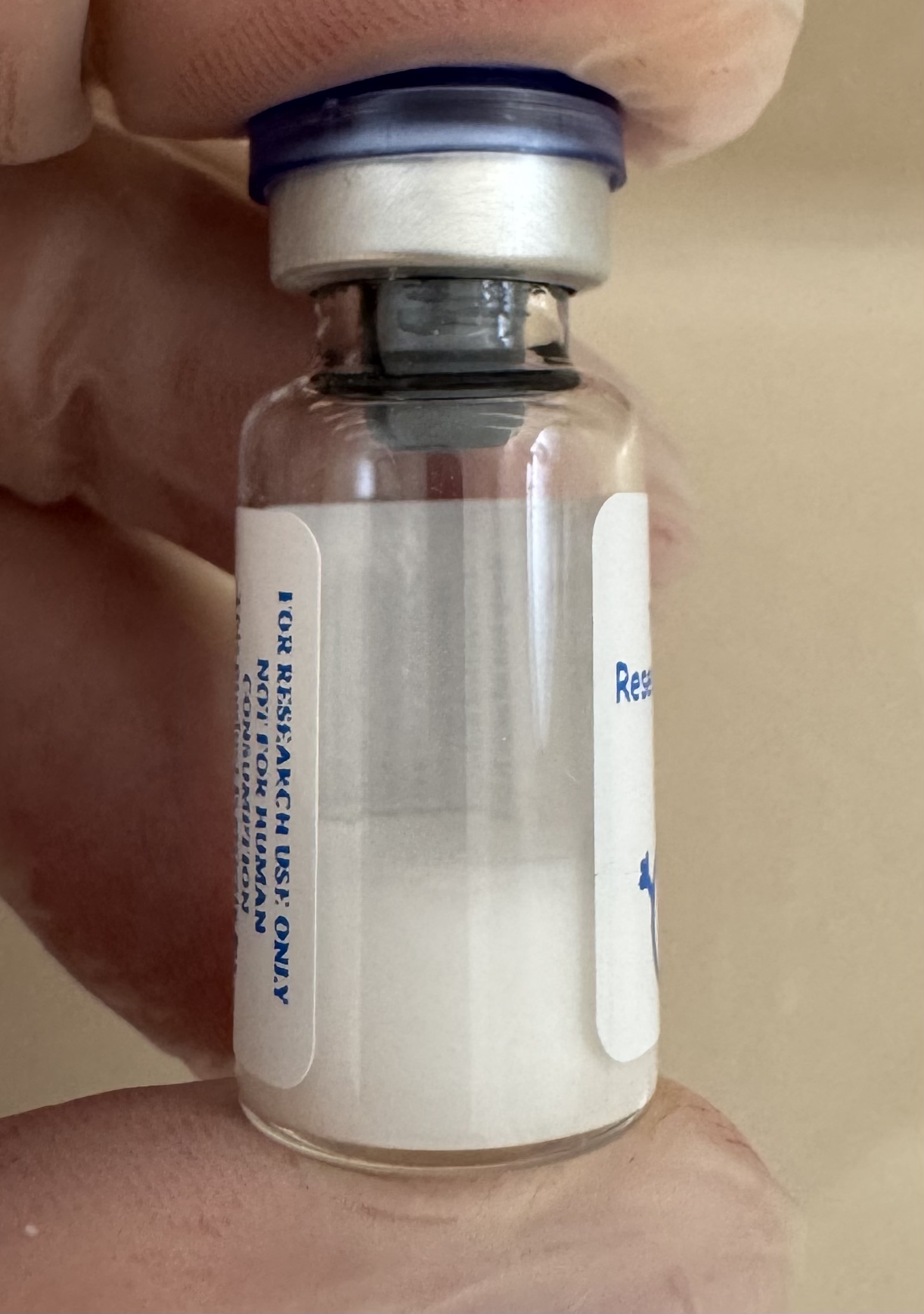 Lyophilized Retatrutide (GIP/GLP-1/glucagon) 10mg powder cake inside the sealed vial