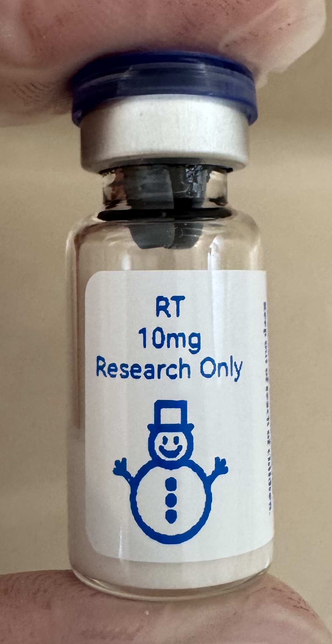 Retatrutide (GIP/GLP-1/glucagon) 10mg freeze-dried research vial with the snowman label