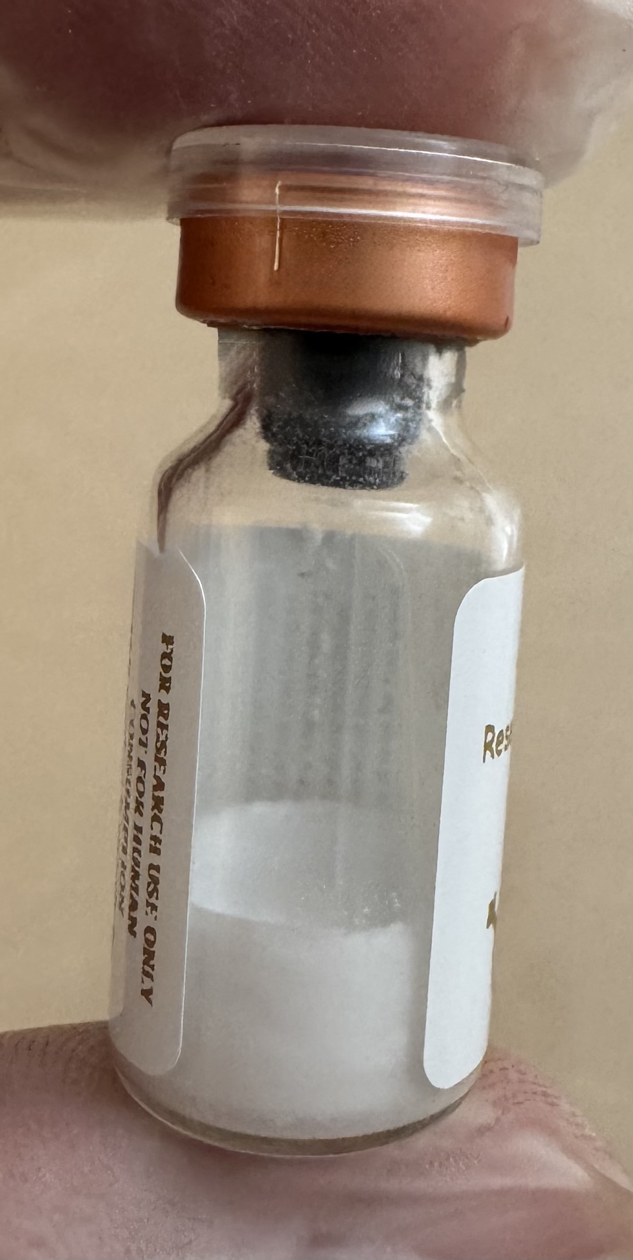 Side view of the Retatrutide (GIP/GLP-1/glucagon) 15mg vial showing the lyophilized powder