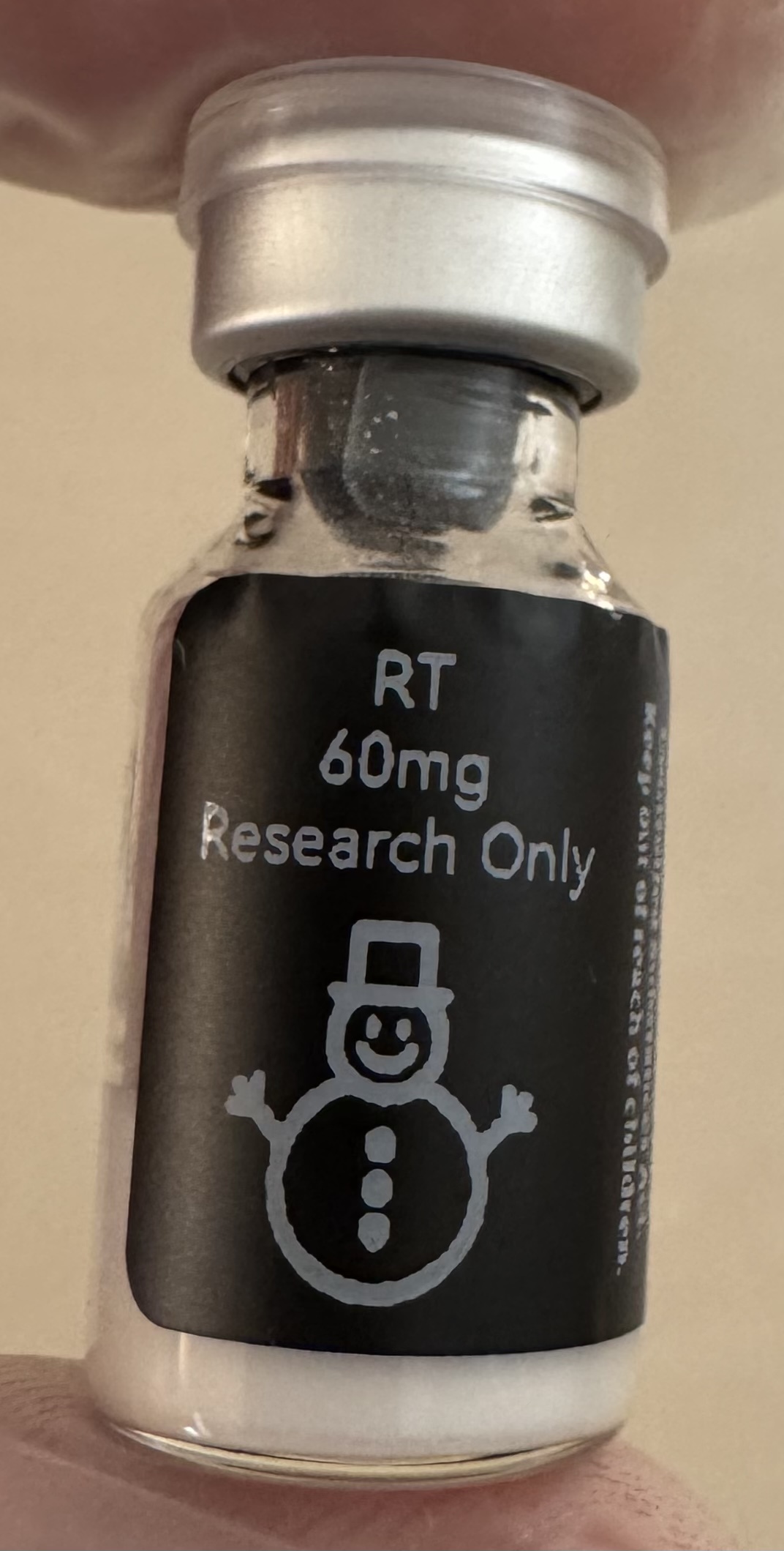 Retatrutide (GIP/GLP-1/glucagon) 60mg freeze-dried research vial with the snowman label