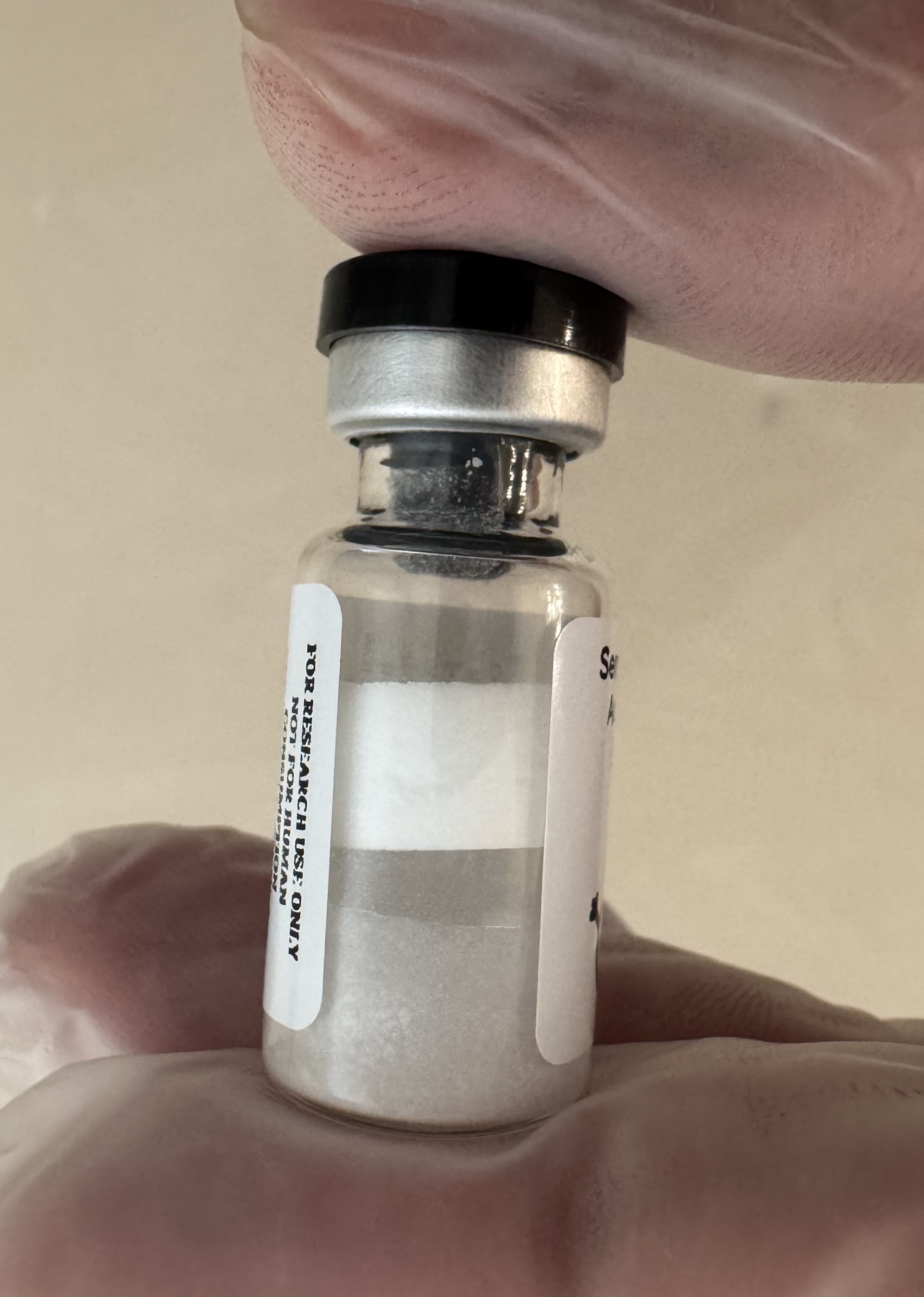 Lyophilized Sermorelin GHRH (1-29) 5mg powder cake inside the sealed vial