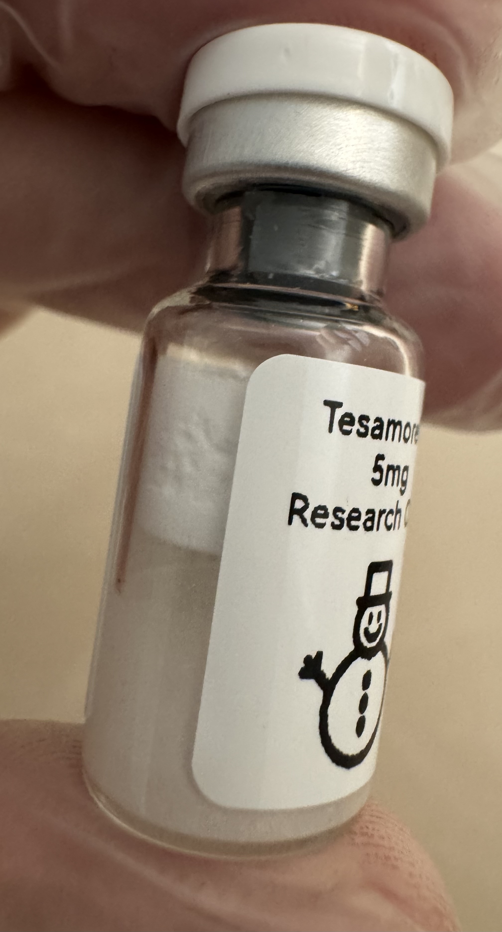 Lyophilized Tesamorelin GHRH analog 5mg powder cake inside the sealed vial
