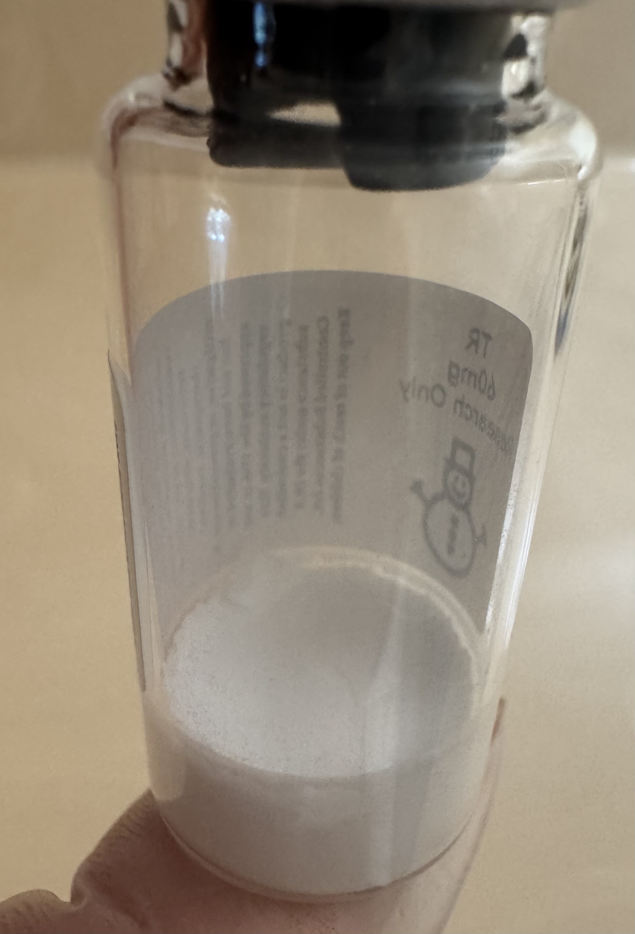 Side view of the Tirzepatide (GIP/GLP-1) 60mg vial showing the lyophilized powder